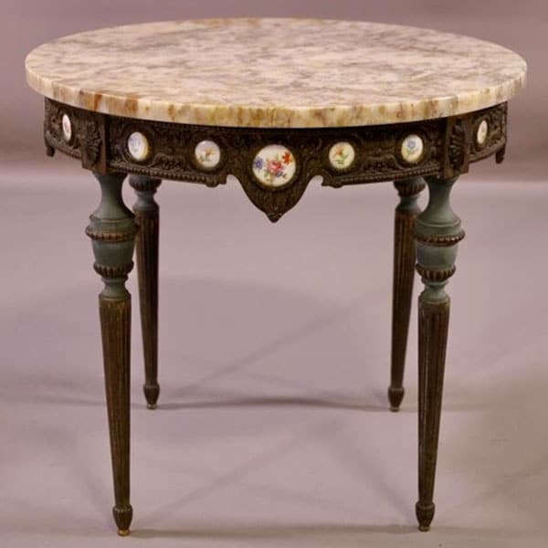ornate metal base with marble top table.