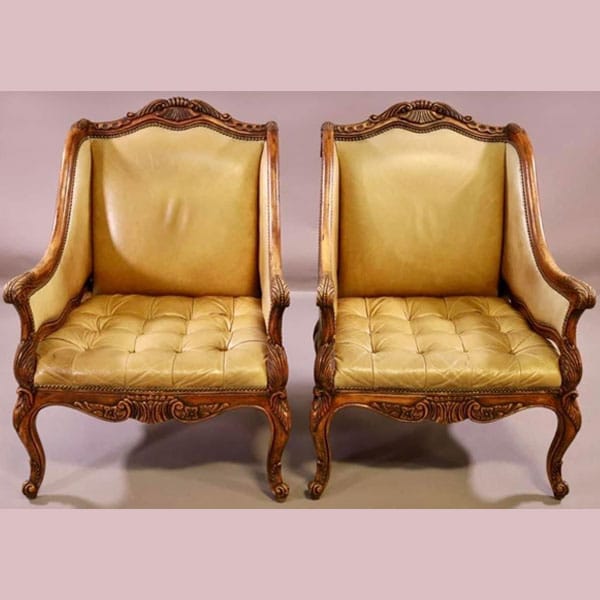wood carved chair with buttery leather.